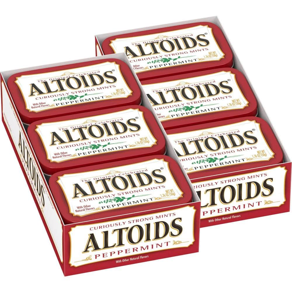 Multiple small metal tins of Altoids Peppermint Mint Candies arranged together.