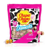 A package of Chupa Chups Cremosa lollipops featuring strawberry and choco-vanilla flavors, with a pink and black cow print design, containing 100 individually wrapped lollipops.