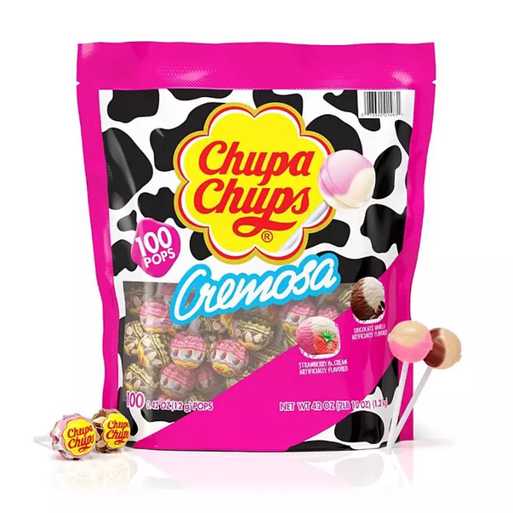 A package of Chupa Chups Cremosa lollipops featuring strawberry and choco-vanilla flavors, with a pink and black cow print design, containing 100 individually wrapped lollipops.