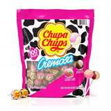 A package of Chupa Chups Cremosa lollipops featuring strawberry and choco-vanilla flavors, with a pink and black cow print design, containing 100 individually wrapped lollipops.