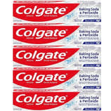 Multiple boxes of Colgate Baking Soda & Peroxide Whitening toothpaste stacked on a white background.