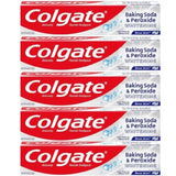 Multiple boxes of Colgate Baking Soda & Peroxide Whitening toothpaste stacked on a white background.